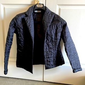 Lightweight quilted jacket. Made in France.  Snap front closures.